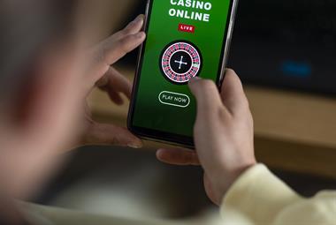 Close up of someone using an online casino on their phone