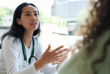 Female GP in consultation with patient