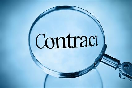 The word contract in a magnifying glass