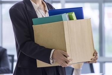 Person holding box as they move out of office