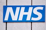 NHS logo on tiled wall